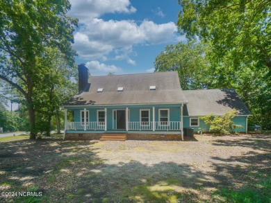 Discover your coastal retreat at 801 Elizabeth Drive, nestled in on Oak Island Golf Club in North Carolina - for sale on GolfHomes.com, golf home, golf lot