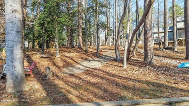 Build your dream waterfront home in the gated, resort-style on River Golf and Country Club at Lake Royale in North Carolina - for sale on GolfHomes.com, golf home, golf lot