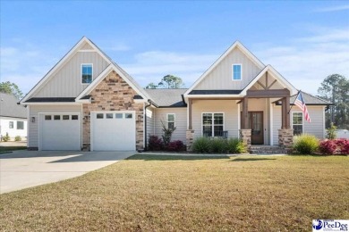 What a beautiful home! The stone entry way brings warmth and on Hartsville Country Club in South Carolina - for sale on GolfHomes.com, golf home, golf lot