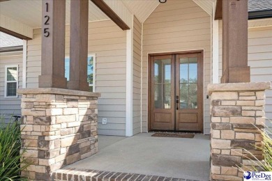 What a beautiful home! The stone entry way brings warmth and on Hartsville Country Club in South Carolina - for sale on GolfHomes.com, golf home, golf lot