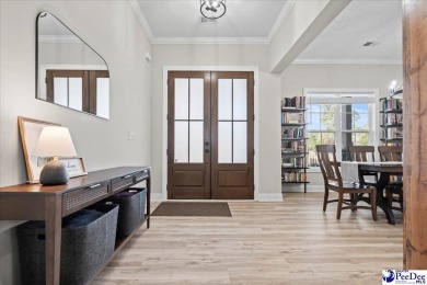 What a beautiful home! The stone entry way brings warmth and on Hartsville Country Club in South Carolina - for sale on GolfHomes.com, golf home, golf lot