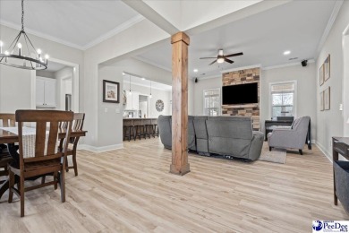 What a beautiful home! The stone entry way brings warmth and on Hartsville Country Club in South Carolina - for sale on GolfHomes.com, golf home, golf lot