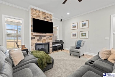 What a beautiful home! The stone entry way brings warmth and on Hartsville Country Club in South Carolina - for sale on GolfHomes.com, golf home, golf lot