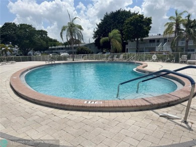 BEAUTIFULLY REMODELED 1ST FLOOR 1BEDROOM/1BATH CONDO, PERMITTED on Hillsboro Pines Golf in Florida - for sale on GolfHomes.com, golf home, golf lot