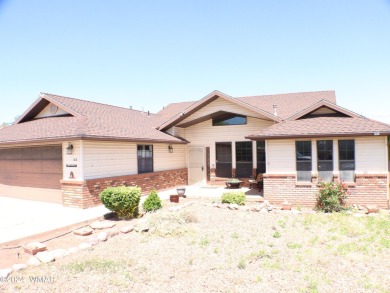 This home backs the fairway of Snowflake's Country Club golf on Snowflake Municipal Golf Course in Arizona - for sale on GolfHomes.com, golf home, golf lot