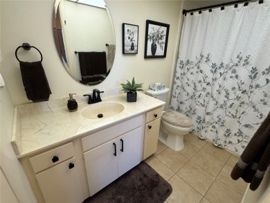 Starting from the colorfully landscaped front entrance to the on IMG Academies Golf and Country Club in Florida - for sale on GolfHomes.com, golf home, golf lot