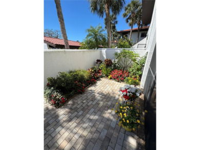 Starting from the colorfully landscaped front entrance to the on IMG Academies Golf and Country Club in Florida - for sale on GolfHomes.com, golf home, golf lot