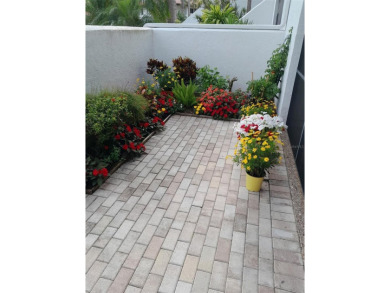 Starting from the colorfully landscaped front entrance to the on IMG Academies Golf and Country Club in Florida - for sale on GolfHomes.com, golf home, golf lot