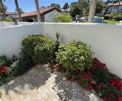 Starting from the colorfully landscaped front entrance to the on IMG Academies Golf and Country Club in Florida - for sale on GolfHomes.com, golf home, golf lot