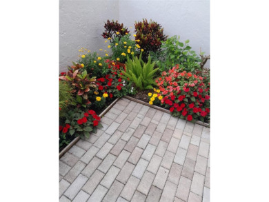 Starting from the colorfully landscaped front entrance to the on IMG Academies Golf and Country Club in Florida - for sale on GolfHomes.com, golf home, golf lot