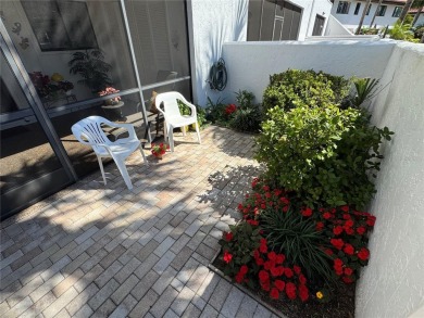 Starting from the colorfully landscaped front entrance to the on IMG Academies Golf and Country Club in Florida - for sale on GolfHomes.com, golf home, golf lot