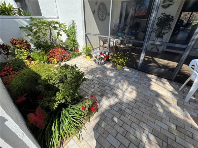 Starting from the colorfully landscaped front entrance to the on IMG Academies Golf and Country Club in Florida - for sale on GolfHomes.com, golf home, golf lot