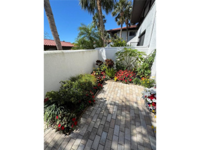 Starting from the colorfully landscaped front entrance to the on IMG Academies Golf and Country Club in Florida - for sale on GolfHomes.com, golf home, golf lot