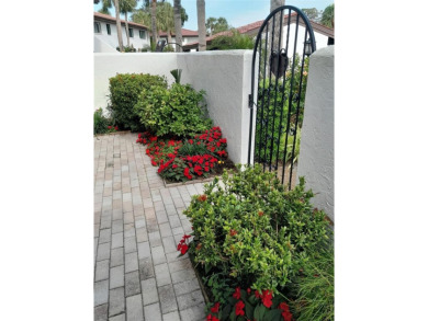 Starting from the colorfully landscaped front entrance to the on IMG Academies Golf and Country Club in Florida - for sale on GolfHomes.com, golf home, golf lot
