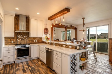 Beautifully upgraded and move-in ready, this two-level paired on The Powder Horn Golf Club - Mountain in Wyoming - for sale on GolfHomes.com, golf home, golf lot