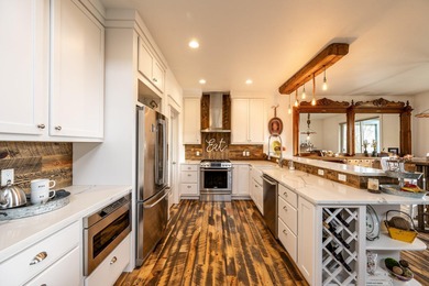 Beautifully upgraded and move-in ready, this two-level paired on The Powder Horn Golf Club - Mountain in Wyoming - for sale on GolfHomes.com, golf home, golf lot