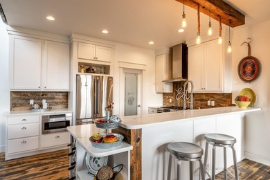 Beautifully upgraded and move-in ready, this two-level paired on The Powder Horn Golf Club - Mountain in Wyoming - for sale on GolfHomes.com, golf home, golf lot