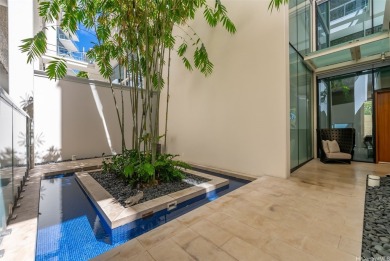 This beautiful Waiea 2-story Villa, 3 bedroom, 3.5 bathroom on Ala Wai Golf Course in Hawaii - for sale on GolfHomes.com, golf home, golf lot