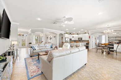 Experience this exquisitely updated spacious lakefront home in on Royal Tee Country Club in Florida - for sale on GolfHomes.com, golf home, golf lot