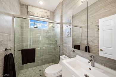 Experience this exquisitely updated spacious lakefront home in on Royal Tee Country Club in Florida - for sale on GolfHomes.com, golf home, golf lot