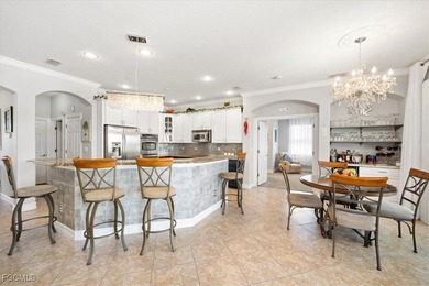 Experience this exquisitely updated spacious lakefront home in on Royal Tee Country Club in Florida - for sale on GolfHomes.com, golf home, golf lot