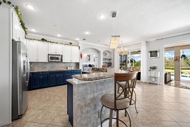 Experience this exquisitely updated spacious lakefront home in on Royal Tee Country Club in Florida - for sale on GolfHomes.com, golf home, golf lot