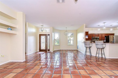 This immaculate, move-in-ready Arvida Laurel model is located on on River Hills Country Club in Florida - for sale on GolfHomes.com, golf home, golf lot