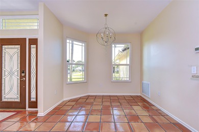 This immaculate, move-in-ready Arvida Laurel model is located on on River Hills Country Club in Florida - for sale on GolfHomes.com, golf home, golf lot