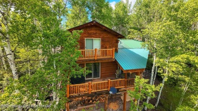 Experience the charm of rustic elegance at 590 Walnut Drive on Star Valley RV Golf Course in Wyoming - for sale on GolfHomes.com, golf home, golf lot
