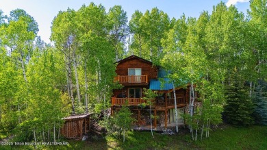Experience the charm of rustic elegance at 590 Walnut Drive on Star Valley RV Golf Course in Wyoming - for sale on GolfHomes.com, golf home, golf lot