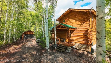 Experience the charm of rustic elegance at 590 Walnut Drive on Star Valley RV Golf Course in Wyoming - for sale on GolfHomes.com, golf home, golf lot