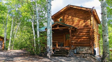 Experience the charm of rustic elegance at 590 Walnut Drive on Star Valley RV Golf Course in Wyoming - for sale on GolfHomes.com, golf home, golf lot