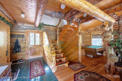 Experience the charm of rustic elegance at 590 Walnut Drive on Star Valley RV Golf Course in Wyoming - for sale on GolfHomes.com, golf home, golf lot