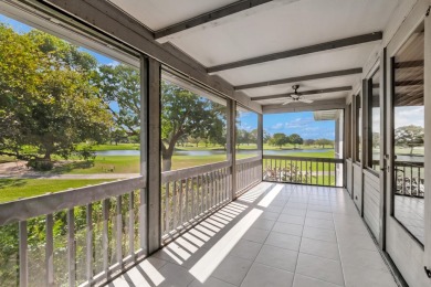 LIVE THE BOCA WEST LIFESTYLE. Second Floor garden apartment with on Boca West Golf and Country Club in Florida - for sale on GolfHomes.com, golf home, golf lot