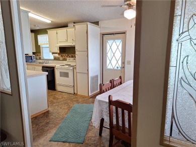 PRICE JUST REDUCED $15,000 - THIS OPEN CONCEPT FLOOR PLAN 1989 on Six Lakes Country Club in Florida - for sale on GolfHomes.com, golf home, golf lot