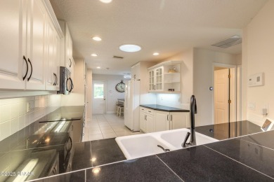 Beautifully updated end-unit 2/2 condo perfectly situated along on Spruce Creek Golf Club in Florida - for sale on GolfHomes.com, golf home, golf lot