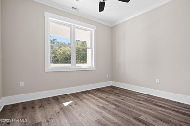 Experience the perfect blend of modern luxury and coastal charm on Brick Landing Plantation Yacht and Golf Club in North Carolina - for sale on GolfHomes.com, golf home, golf lot