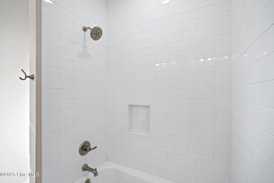 Experience the perfect blend of modern luxury and coastal charm on Brick Landing Plantation Yacht and Golf Club in North Carolina - for sale on GolfHomes.com, golf home, golf lot