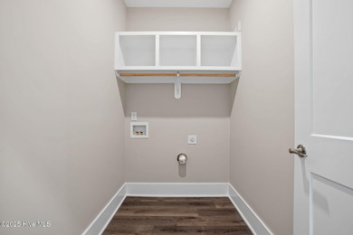 Experience the perfect blend of modern luxury and coastal charm on Brick Landing Plantation Yacht and Golf Club in North Carolina - for sale on GolfHomes.com, golf home, golf lot