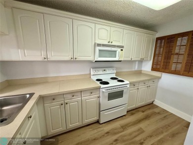Beautiful bright and airy unit overlooking the lake and on Pine Island Ridge Country Club in Florida - for sale on GolfHomes.com, golf home, golf lot
