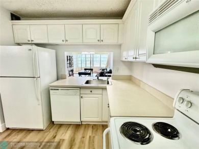 Beautiful bright and airy unit overlooking the lake and on Pine Island Ridge Country Club in Florida - for sale on GolfHomes.com, golf home, golf lot