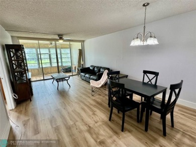 Beautiful bright and airy unit overlooking the lake and on Pine Island Ridge Country Club in Florida - for sale on GolfHomes.com, golf home, golf lot