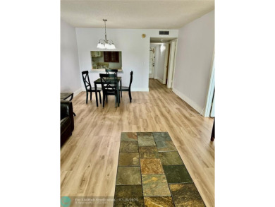 Beautiful bright and airy unit overlooking the lake and on Pine Island Ridge Country Club in Florida - for sale on GolfHomes.com, golf home, golf lot