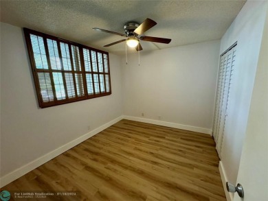 Beautiful bright and airy unit overlooking the lake and on Pine Island Ridge Country Club in Florida - for sale on GolfHomes.com, golf home, golf lot