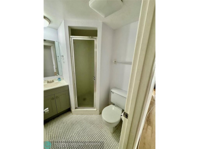 Beautiful bright and airy unit overlooking the lake and on Pine Island Ridge Country Club in Florida - for sale on GolfHomes.com, golf home, golf lot