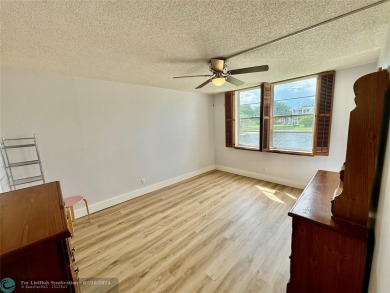 Beautiful bright and airy unit overlooking the lake and on Pine Island Ridge Country Club in Florida - for sale on GolfHomes.com, golf home, golf lot