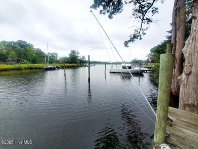 Waterfront living at its finest! Welcome to 5630 Gondolier Drive on Harbour Point Golf Club in North Carolina - for sale on GolfHomes.com, golf home, golf lot