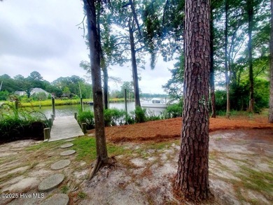 Waterfront living at its finest! Welcome to 5630 Gondolier Drive on Harbour Point Golf Club in North Carolina - for sale on GolfHomes.com, golf home, golf lot