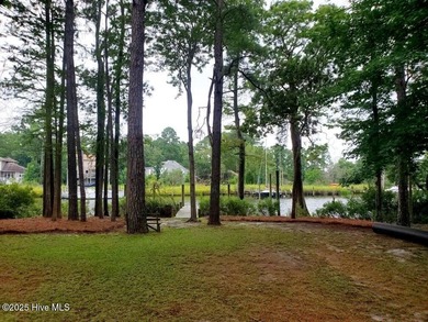 Waterfront living at its finest! Welcome to 5630 Gondolier Drive on Harbour Point Golf Club in North Carolina - for sale on GolfHomes.com, golf home, golf lot