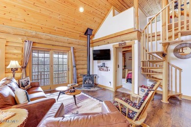 Tucked in the heart of Granby, this enchanting log cabin on Grand Elk Ranch and Club in Colorado - for sale on GolfHomes.com, golf home, golf lot